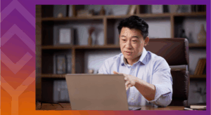 Person speaking in front of a laptop