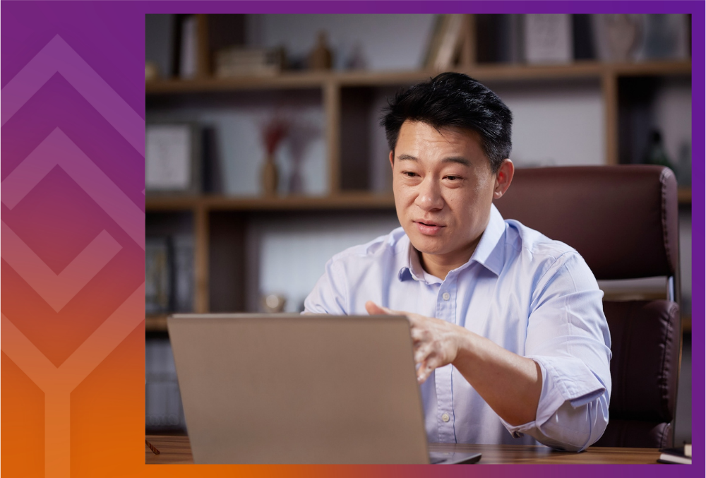 Person speaking in front of a laptop